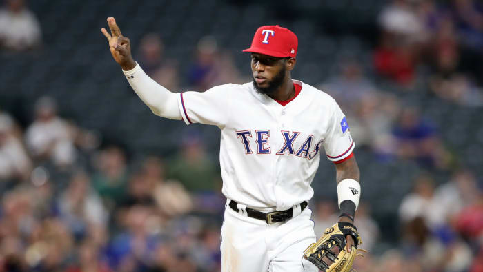 Aug 16, 2018; Arlington, TX, USA; Texas Rangers third baseman Jurickson Profar (19) reacts after the Texas Rangers record a triple play during the fourth inning against the Los Angeles Angels at Globe Life Park in Arlington.